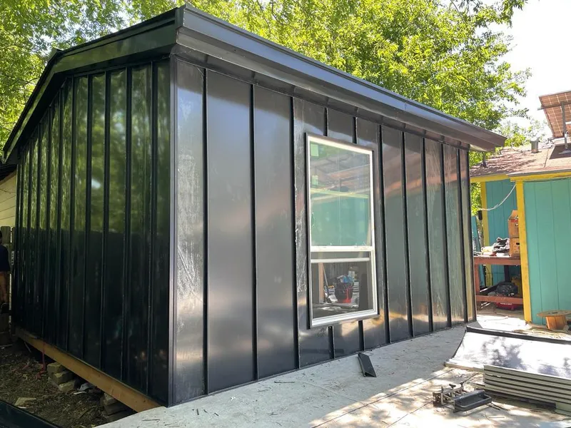 Black standing seam metal wall panels for Roof Inspection in McKenzie